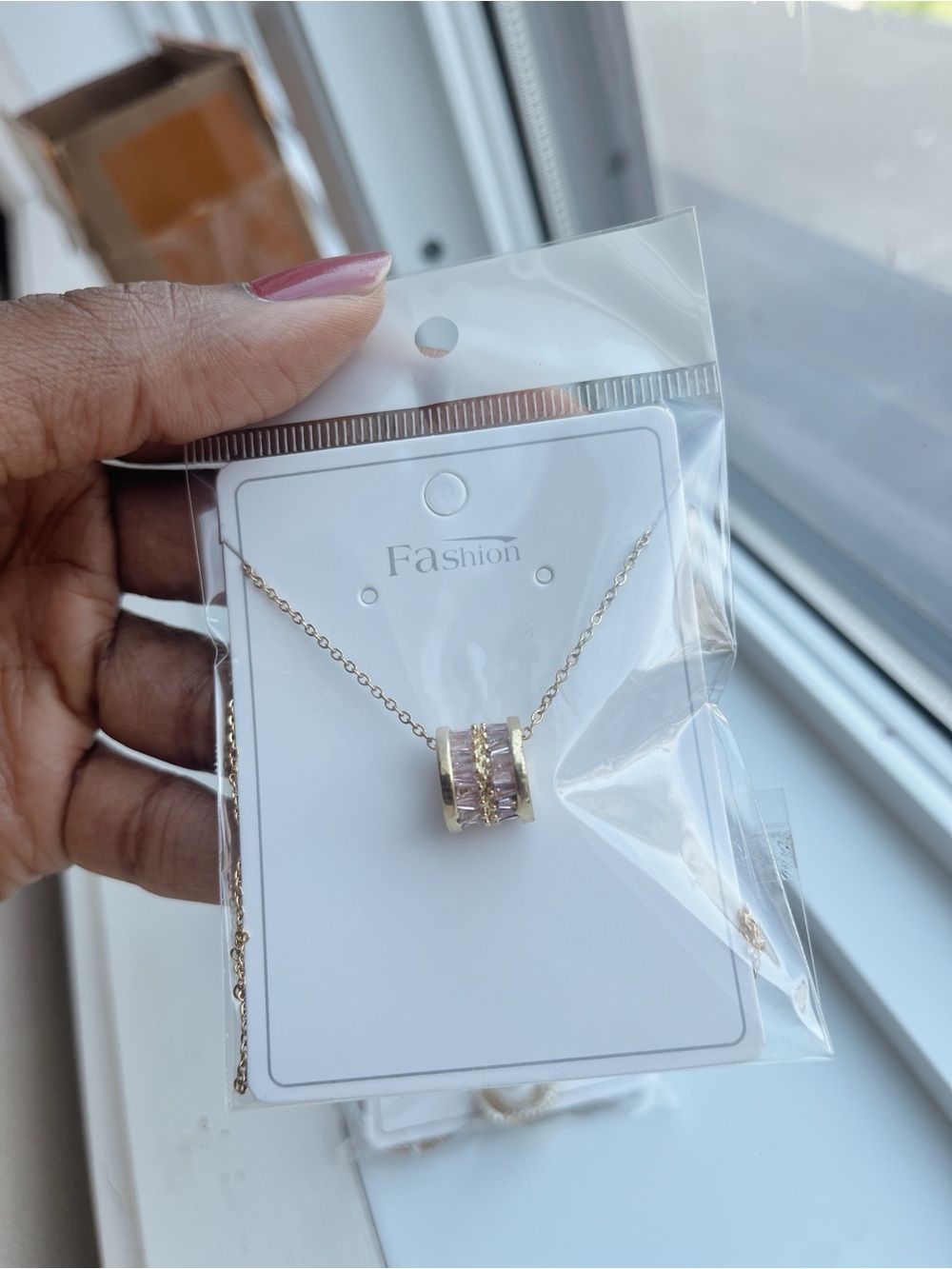 Gold Necklace with Pink Crystal Barrel Pendant